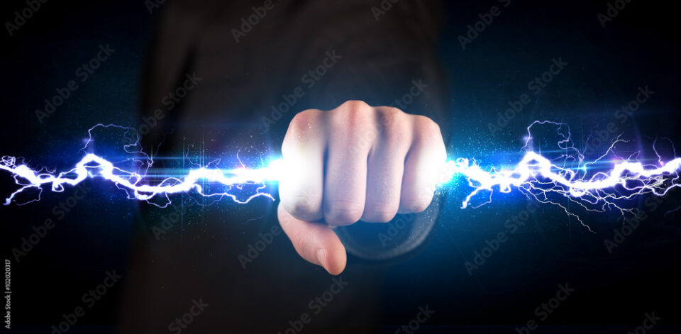 Business man holding electricity light bolt in his hands