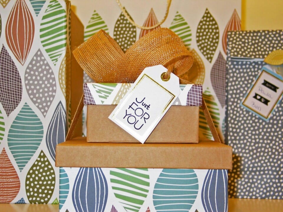 Close up photo of gift boxes with greeting card