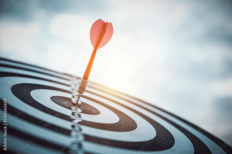 dart arrow hitting in the target center of dartboard.