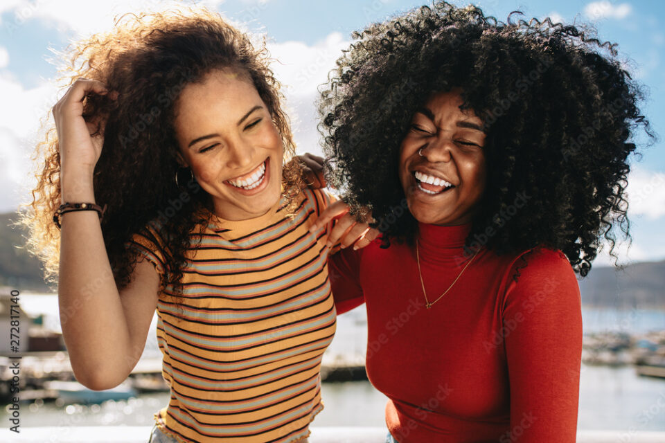 Female friends having fun on beach