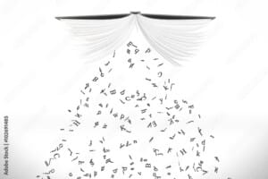 Letters pour out from the opened book at white background