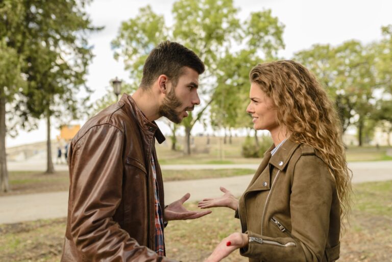 Man and woman wearing brown leather jackets