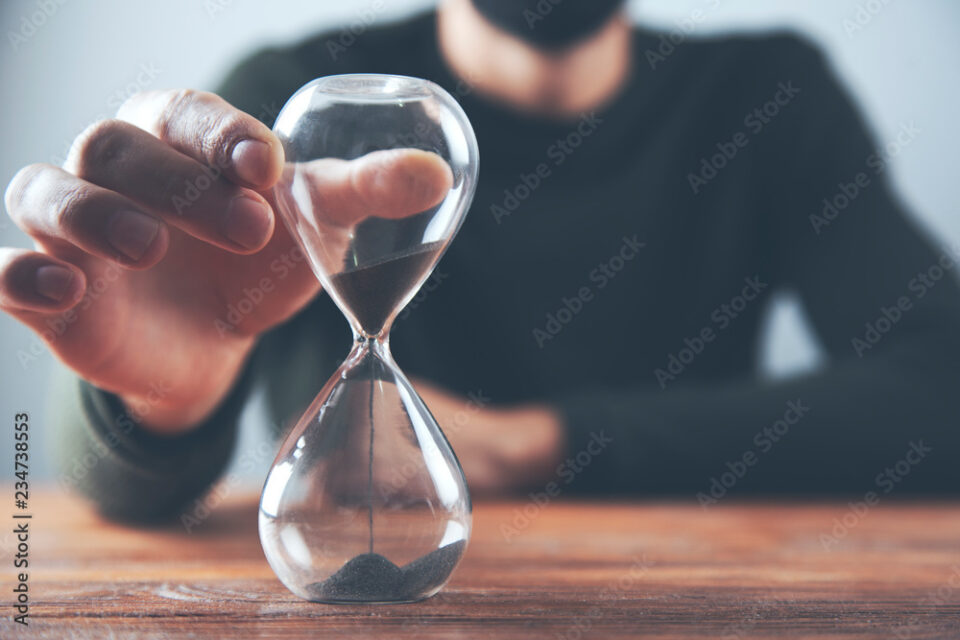 man hand sand clock