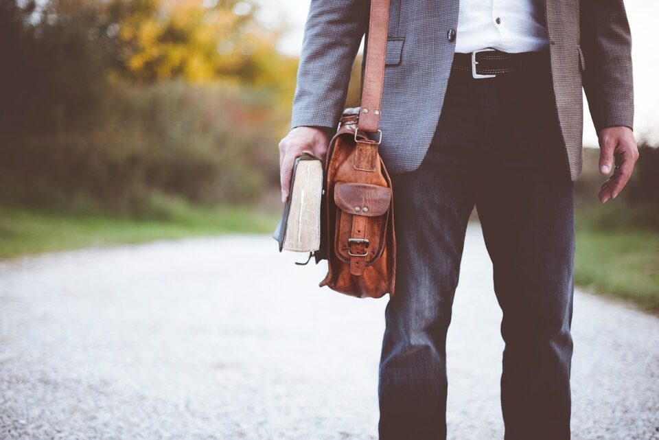 people, man, bag, clothing, bible, book, reading, street, coat, jeans, bible, bible, bible, bible, bible