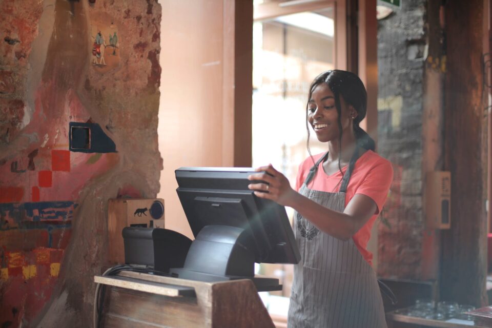 young female working on cash register