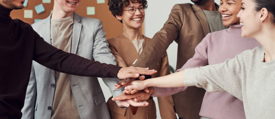 Photo of people holding each other s hands