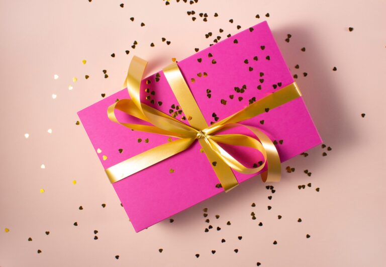 pink gift box with yellow ribbon