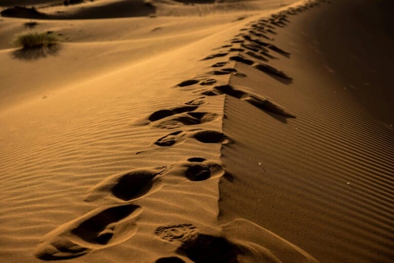 Sand dune with foot prints