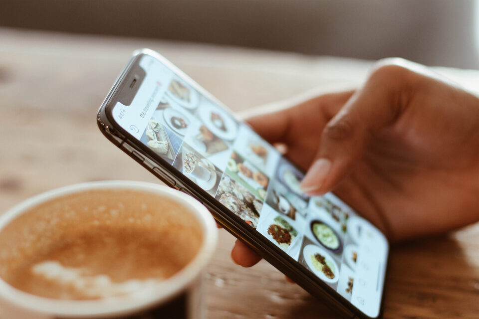 Selective focus photography of person using iphone x