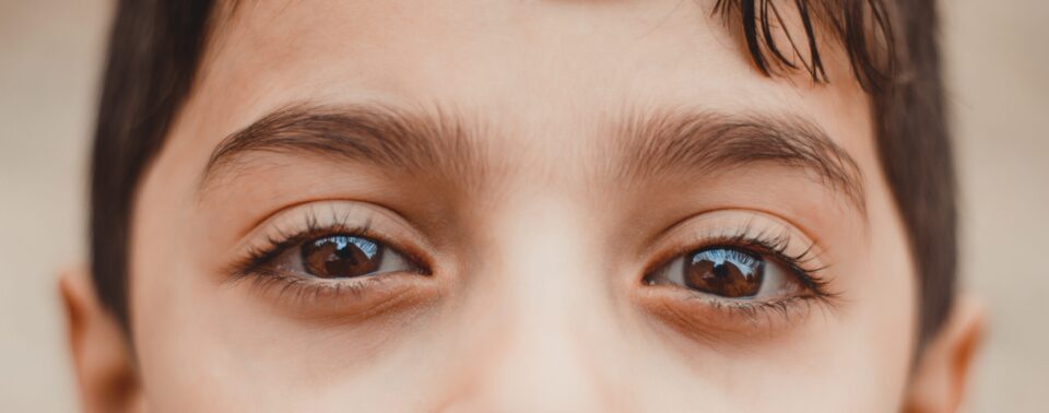 Shallow focus photography of human eyes