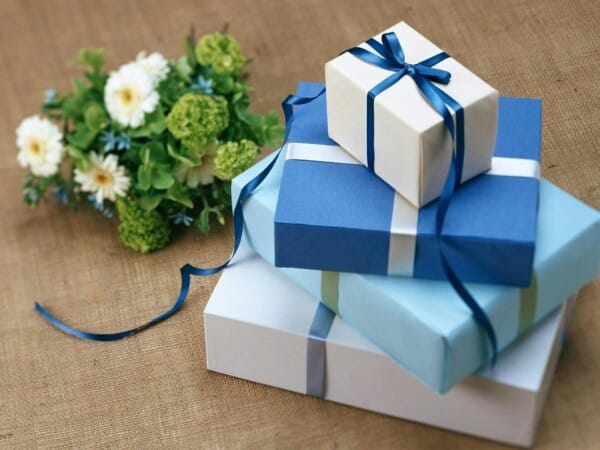 Stacked blue colored gift boxes