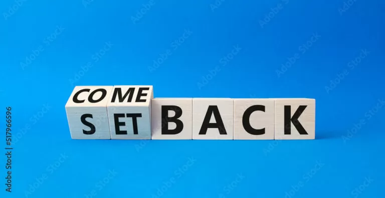 Comeback and setback symbol. Turned cubes with words setback and comeback. Beautiful blue background. Business concept. Copy space